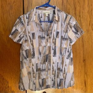 Dana Buchman short sleeve button down blouse. Slight flare to hemline petite med